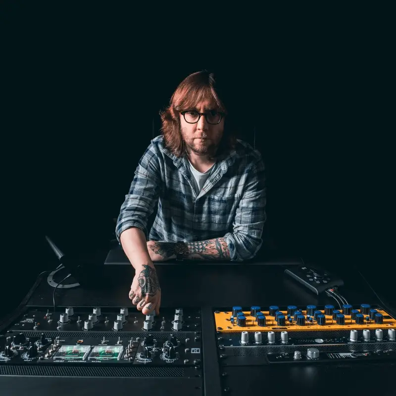 Photo of Graeme at his desk